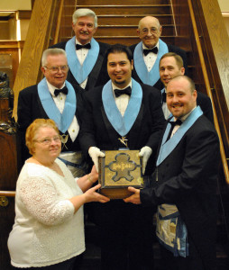 The officers of the Lodge accept the Bible. Picture are: (front) Mrs. Karen Sensemen and Bro. Stephen E. Poff, Worshipful Master. (second row) Bro. Robert Gregiore, PM, Secretary; Bro. Seth C. Anthony, Senior Deacon and Lodge Historian; Bro. Jeffrey A. Schmidt, Junior Warden. (top row) Bro. H. Eugene Geib, PM, Senior Warden and Bro. Lawrence R. Ebersole, PM, Treasurer